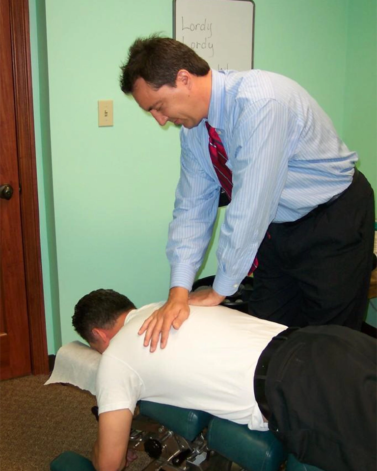 https://www.meridian-chiropractic.com/wp-content/uploads/2023/07/Chiropractor-Indianapolis-IN-Jeffry-Yoder-Adjusting-Patient-HP.webp